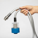 Hand holding a hydrogen water filter hose with a blue and silver connector