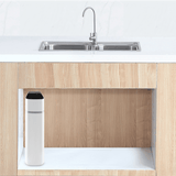 Modern under-sink tankless reverse osmosis water filter in light wood kitchen